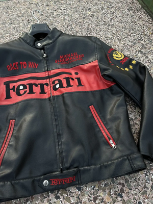 Detailed shot of the jacket sleeve showing the "World Champion 2004" emblem with four stars and red "Ferrari" text.