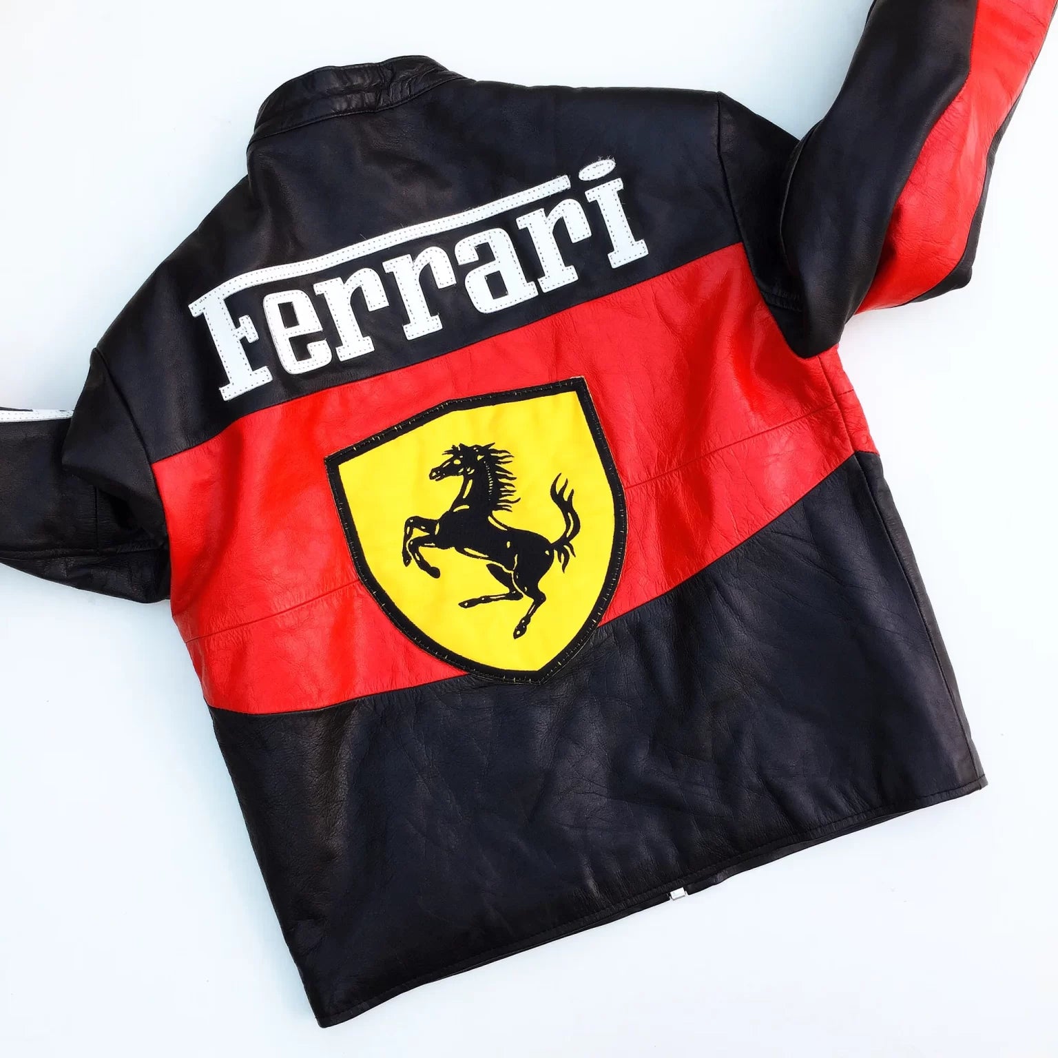 Ferrari leather jacket with logo on a white background
