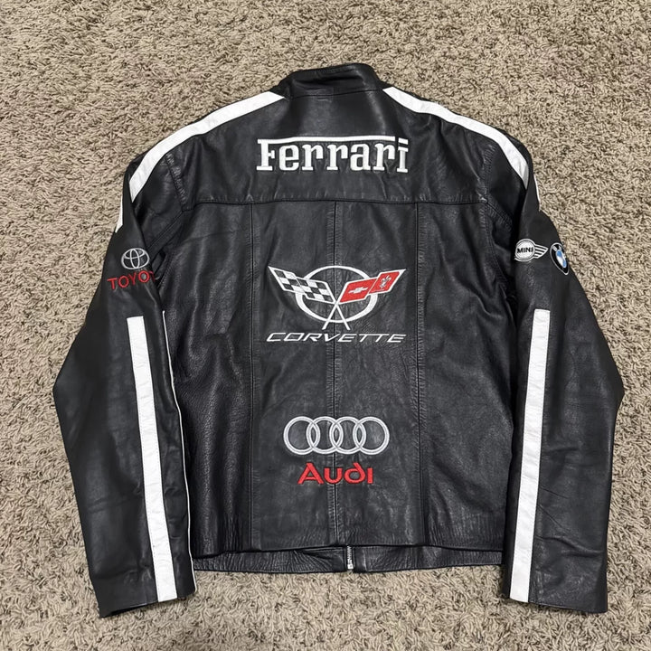 Detailed shot of the center back featuring the Corvette crossed flags logo and the Audi rings logo with white stripe accents.
