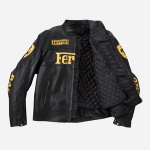 Front view of a black leather Ferrari Racing jacket with bold yellow Ferrari and Michelin logos on a white background.
