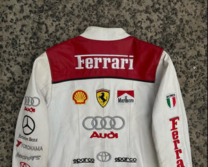 Detailed shot of the sleeve, showing the vertical red Ferrari text and the "ITALIA" patch with the Italian flag.