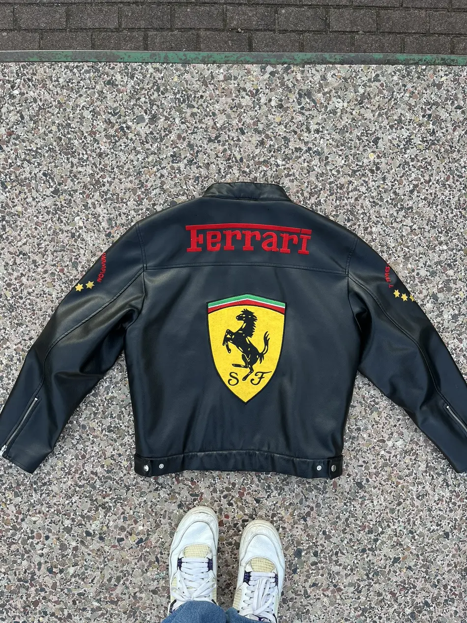 Close-up of the jacket's chest area, highlighting "Michael Schumacher F1 World Champion" text and the red "Ferrari" stripe.