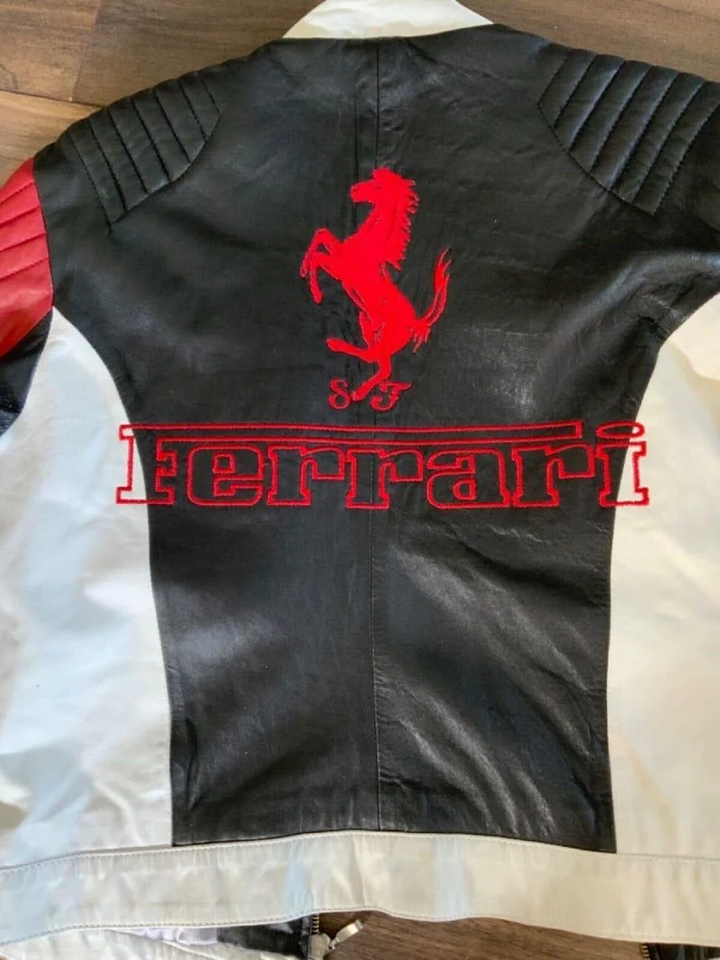 Back view of the Ferrari racing jacket, showing the large red prancing horse logo, "Ferrari" text, and quilted shoulder panels.
