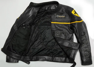 Full-view product image of a black genuine leather Ferrari Racing jacket with yellow accents, a zippered front, and a large embossed Ferrari logo on the chest.