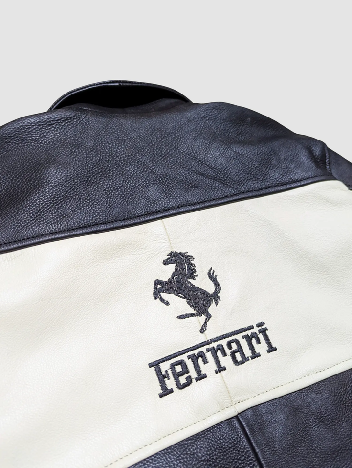 Detailed shot of the sleeve showing the vertical "FORMULA 1" text and the leather's texture and stitching.