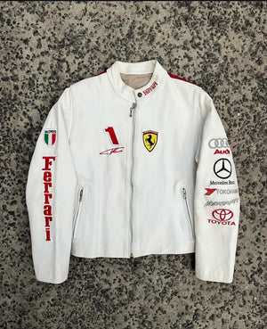 Front view of a white and red leather racing jacket, showcasing Ferrari, Audi, Mercedes, and Toyota sponsor logos.